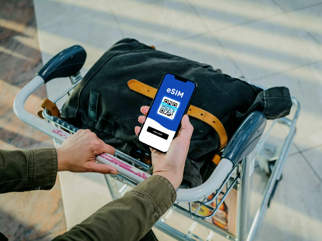 Traveler Holding Passport – Easy eSIM Activation Abroad – Gohub